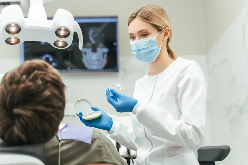 Patient discussing oral health with a dentist